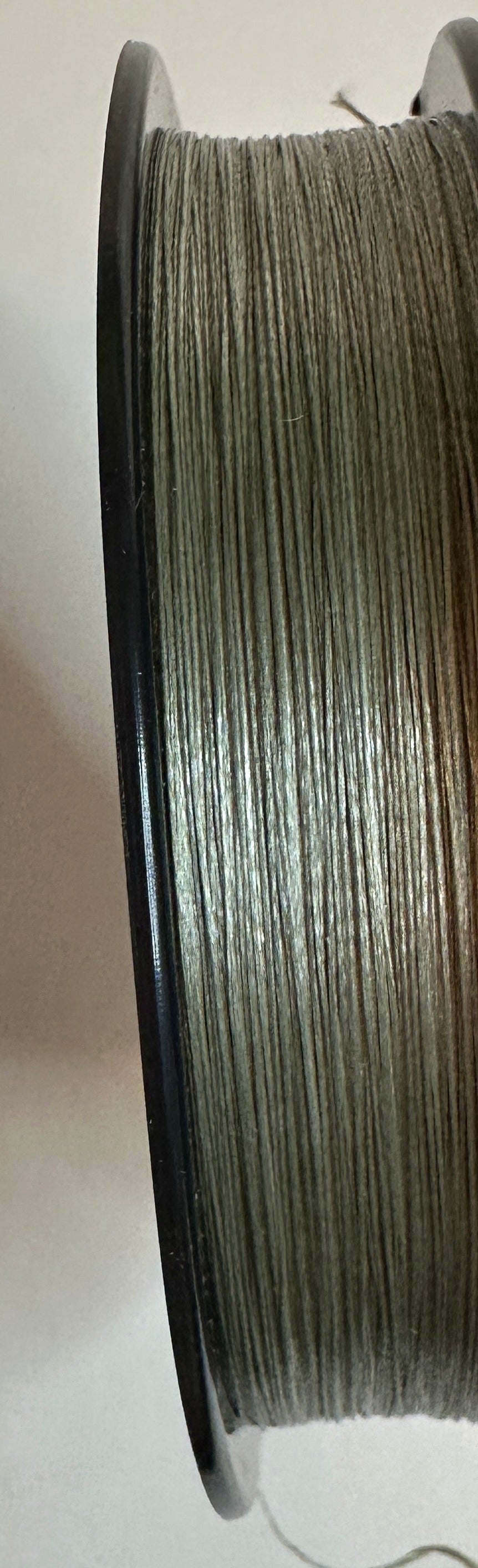 TUF-LINE XP Braided Fishing Line 10 lb Test 150 Yards Green — spool side showing the green braided line