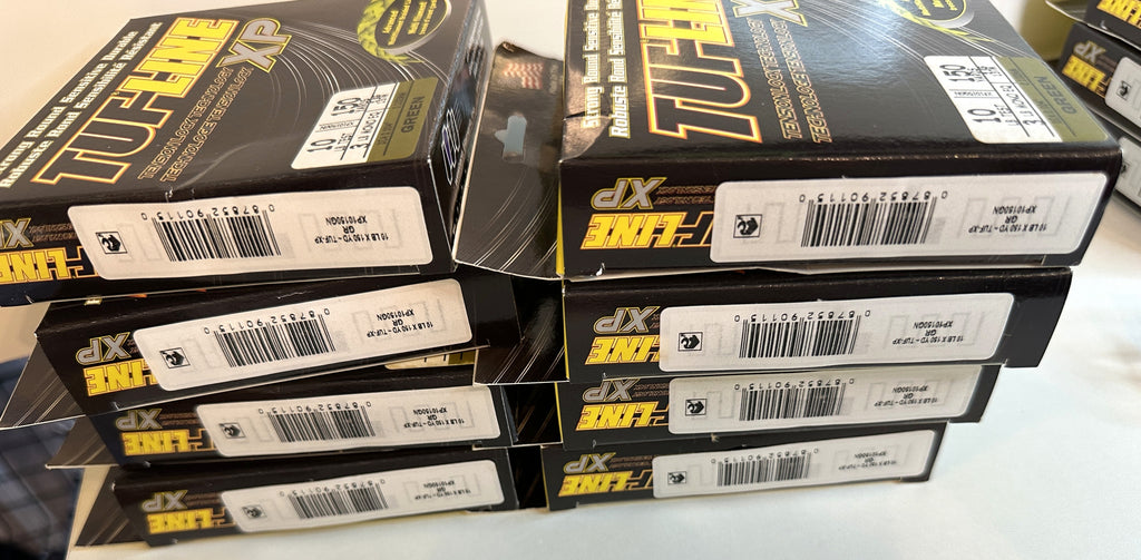 TUF-LINE XP Braided Fishing Line 10 lb Test 150 Yards Green — stack of boxes