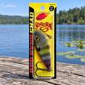 Strike King Red Eyed Shad Neon Bluegill retail package on a dock