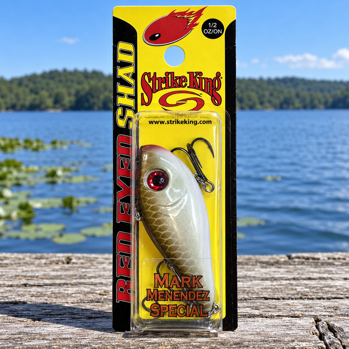 Strike King Red Eyed Shad 1/2 oz Copper Nose Shad - full retail package on dock by lake