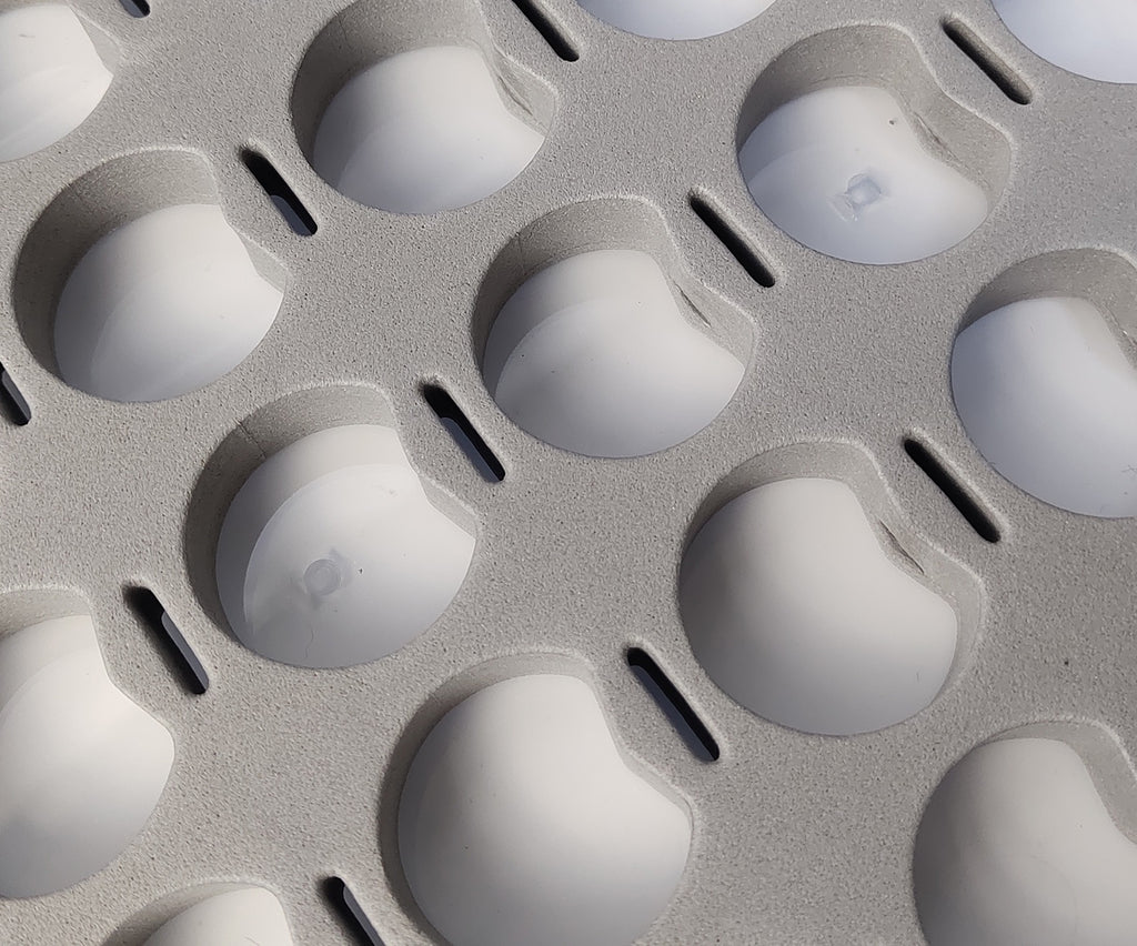Close-up of the grey foam insert spool wells