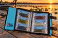 Z-Man Bait BinderZ open on a dock at sunset with ElaZtech bait bags