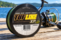TUF-LINE XP 10 lb green braided line spool on a dock by the lake